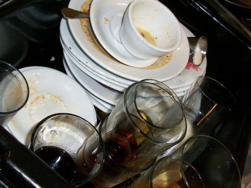 a sink full of dirty dishes