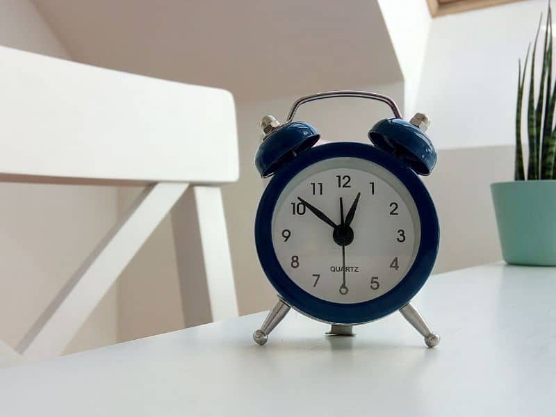 an alarm clock sitting in a desk