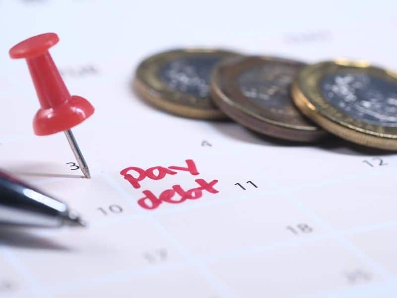 a calendar with the words "py debt" written in red