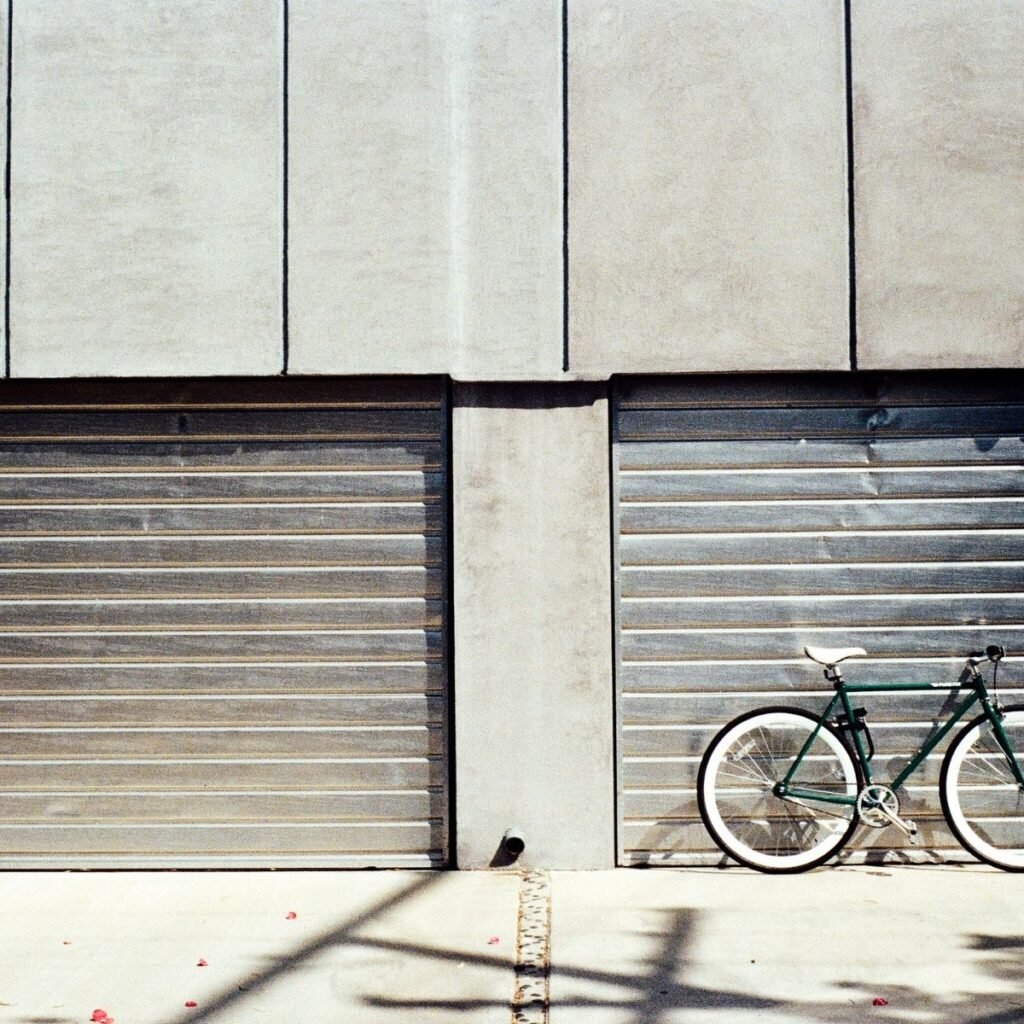 2 garage doors with a bike in front