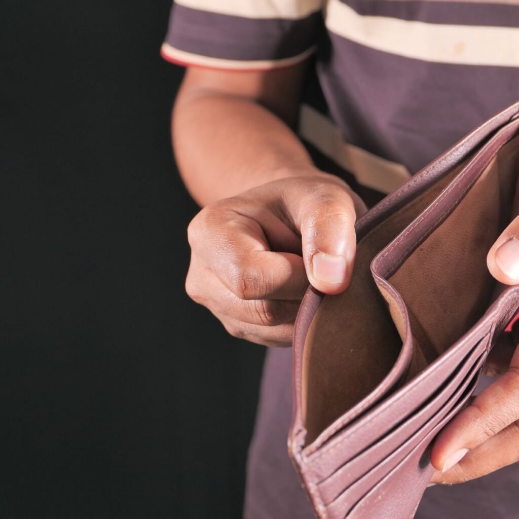 a man holding his empty wallet open
