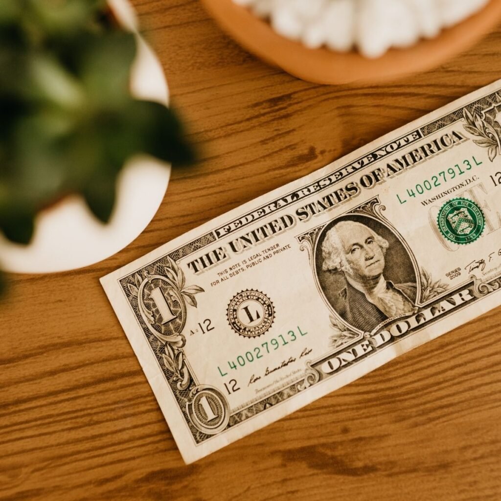 a dollar bill sitting on a table