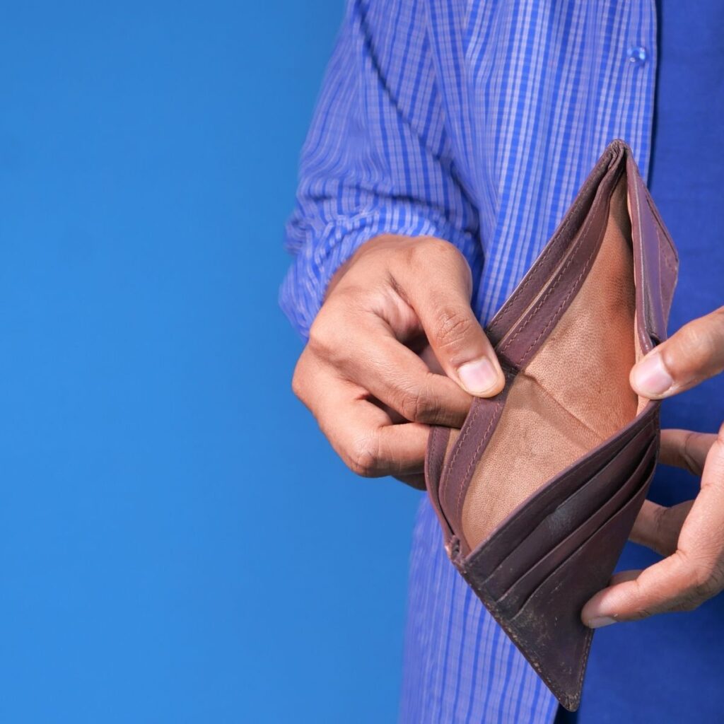 a man holding an empty wallet open