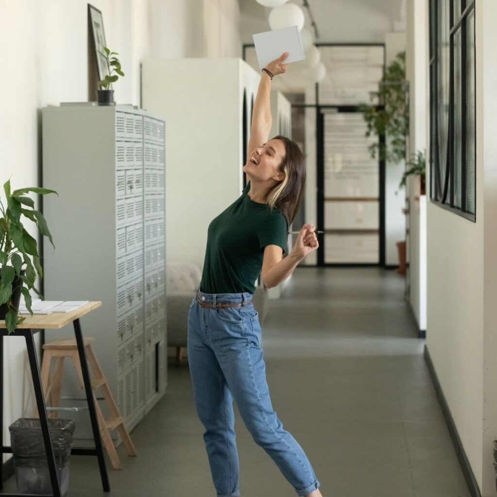 a woman dancing in a hallway