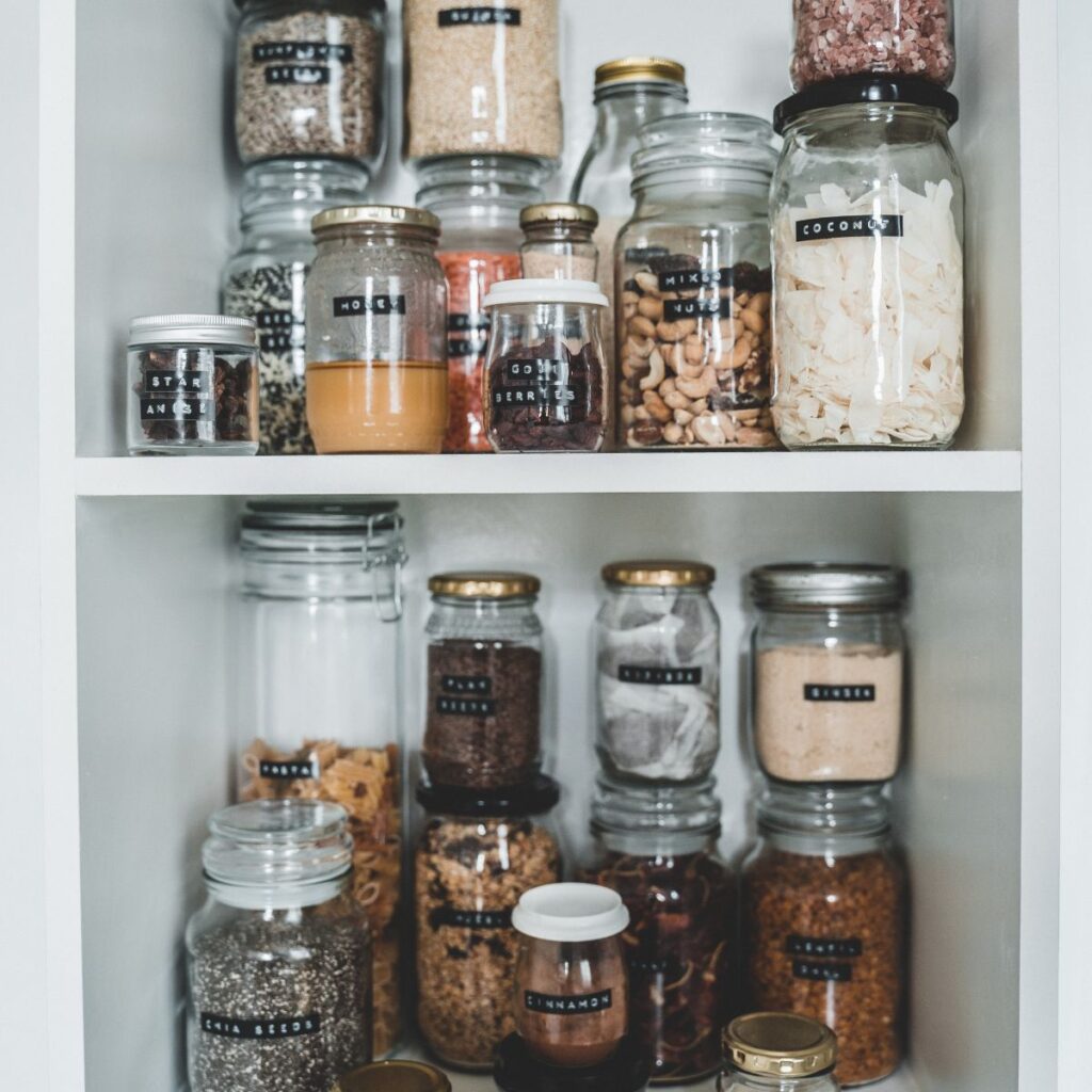 jars of food organized on pantry shelves