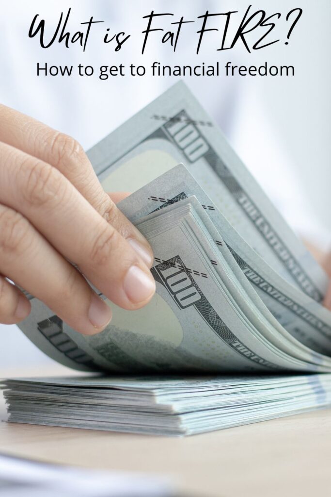 a hand flipping through a stack of 100 dollar bills